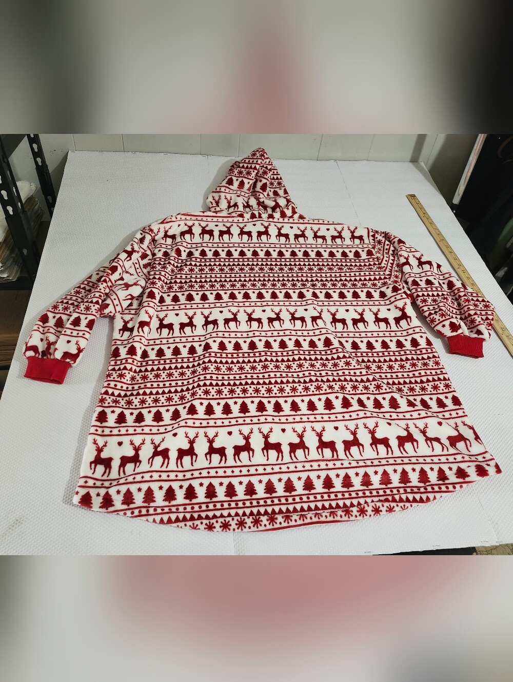 Throwzy wearable blanket hoodie features a red and white reindeer holiday patter - Picture 11 of 12